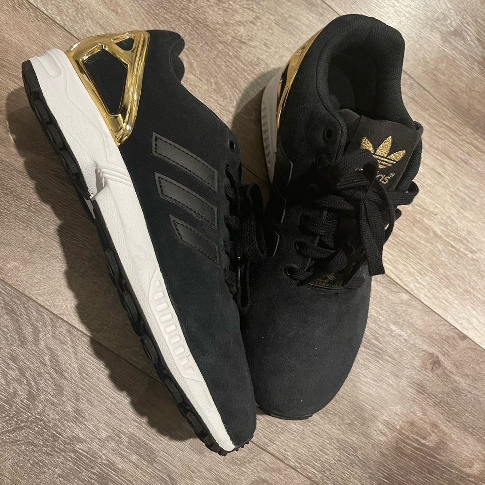 Adidas ZX FLUX Torsion sneakers. Black and gold. Never been worn. Size 7.